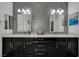Elegant bathroom features a double vanity, quartz countertop, and designer mirrors at 362 Port Reggio St, Las Vegas, NV 89138