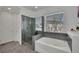 Luxurious bathroom features a soaking tub, glass shower, and elegant tilework at 362 Port Reggio St, Las Vegas, NV 89138