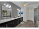 Modern bathroom boasts a double vanity, mosaic wall, and stylish lighting at 362 Port Reggio St, Las Vegas, NV 89138