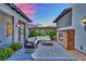 Charming courtyard featuring a cozy fireplace, comfortable seating, and elegant landscaping at 362 Port Reggio St, Las Vegas, NV 89138