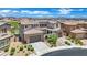 Beautiful two-story home with a three-car garage and manicured landscaping, showcasing elegant architecture at 362 Port Reggio St, Las Vegas, NV 89138