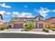 Charming two-story home boasts a three-car garage, stone accents, and well-maintained landscaping at 362 Port Reggio St, Las Vegas, NV 89138