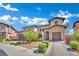 Lovely two-story house featuring stone accents, a three-car garage, and neat landscaping at 362 Port Reggio St, Las Vegas, NV 89138