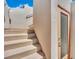 Stairs lead to an exterior door and upper levels of the house at 362 Port Reggio St, Las Vegas, NV 89138