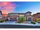 Elegant two-story home showcasing a well-maintained front yard, two-car garage, and stone accents at 362 Port Reggio St, Las Vegas, NV 89138