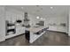 Contemporary kitchen boasts a large island, stainless steel appliances, and ample storage within white cabinetry at 362 Port Reggio St, Las Vegas, NV 89138