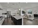 Open kitchen with a large island, stainless steel appliances, and dining area creates a wonderful cooking experience at 362 Port Reggio St, Las Vegas, NV 89138