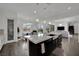 Spacious kitchen island with dark cabinets, white countertop, and stainless steel appliances, creating a modern space at 362 Port Reggio St, Las Vegas, NV 89138