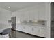 Modern kitchen features white cabinetry, stainless steel appliances, and ample counter space, perfect for cooking and hosting at 362 Port Reggio St, Las Vegas, NV 89138