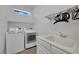 Laundry room featuring modern washer and dryer, sink, and functional layout at 362 Port Reggio St, Las Vegas, NV 89138