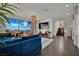 Open-concept living room boasts a large sliding glass door and contemporary furnishings at 362 Port Reggio St, Las Vegas, NV 89138