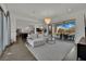 Inviting living room with open floorplan, leading to the backyard with an outdoor dining and lounge area at 362 Port Reggio St, Las Vegas, NV 89138