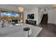 Open living room featuring sleek decor, chandelier lighting, and backyard access, great for entertaining and relaxing at 362 Port Reggio St, Las Vegas, NV 89138