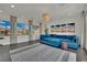 Cozy living room features a stylish blue sofa and a contemporary light fixture at 362 Port Reggio St, Las Vegas, NV 89138