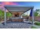 Outdoor kitchen featuring a grill, bar, and seating area for cooking and entertaining outside at 362 Port Reggio St, Las Vegas, NV 89138