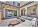Elegant covered patio, wicker furniture, and easy indoor-outdoor flow for relaxed living at 362 Port Reggio St, Las Vegas, NV 89138