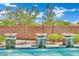 A swimming pool with decorative fountain features and a brick wall for added privacy at 362 Port Reggio St, Las Vegas, NV 89138