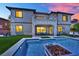 Beautiful backyard showcasing a sparkling pool with water feature, seating, and manicured lawn at 362 Port Reggio St, Las Vegas, NV 89138