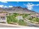 Picturesque street view with lush landscaping and a mountain backdrop, showcasing the neighborhood's natural beauty at 362 Port Reggio St, Las Vegas, NV 89138