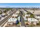 An aerial view shows the neighborhood and townhomes from an elevated perspective on a clear day, with mountains behind at 3683 Villa Knolls East Dr, Las Vegas, NV 89120
