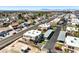 An aerial view showcases a neighborhood with two-story townhomes with carports and a mountain range backdrop at 3683 Villa Knolls East Dr, Las Vegas, NV 89120