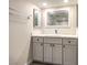 Bathroom featuring a bright vanity with modern fixtures, a large mirror, and a towel rack at 3683 Villa Knolls East Dr, Las Vegas, NV 89120