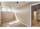 Bedroom featuring light-colored walls, modern wood-look floors, and natural light at 3683 Villa Knolls East Dr, Las Vegas, NV 89120