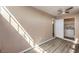 Bedroom featuring light-colored walls, modern wood-look floors, and nearby laundry room at 3683 Villa Knolls East Dr, Las Vegas, NV 89120