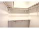 Walk-in closet features built-in shelves and rod for organized storage at 3683 Villa Knolls East Dr, Las Vegas, NV 89120