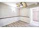 Cozy dining area with wainscoting and a modern ceiling fan fixture at 3683 Villa Knolls East Dr, Las Vegas, NV 89120