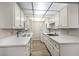 Updated kitchen with quartz countertops, stainless steel appliances, and ample cabinet space at 3683 Villa Knolls East Dr, Las Vegas, NV 89120