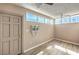 Spacious living room with tiled ceiling, a/c unit, and several windows providing plenty of natural light at 3683 Villa Knolls East Dr, Las Vegas, NV 89120
