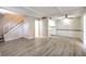 Spacious living room featuring vinyl floors and white trim throughout the house at 3683 Villa Knolls East Dr, Las Vegas, NV 89120
