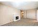 Spacious living room with fireplace, neutral carpet, and view to hallway at 3683 Villa Knolls East Dr, Las Vegas, NV 89120