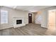 Inviting living room with vinyl floors, fireplace, and natural light from window at 3683 Villa Knolls East Dr, Las Vegas, NV 89120