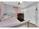 This bedroom features white walls, light colored wood floor, and a double door closet at 3905 Blairmoor St, North Las Vegas, NV 89032