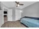 Bright bedroom features a sliding door closet, ceiling fan, window, and neutral decor at 3905 Blairmoor St, North Las Vegas, NV 89032