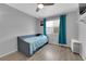Cozy bedroom featuring a daybed, ceiling fan, window, and neutral decor at 3905 Blairmoor St, North Las Vegas, NV 89032