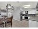 This kitchen is spacious and well-equipped, featuring stainless steel appliances, a bright window, and a dining table at 3905 Blairmoor St, North Las Vegas, NV 89032