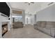 Bright living room featuring a fireplace, TV, two sofas and a high ceiling, perfect for relaxing at 3905 Blairmoor St, North Las Vegas, NV 89032