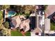 Overhead view of the house showcasing the tile roof, pool, solar panels, and green backyard at 4075 E Oquendo Rd, Las Vegas, NV 89120