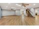 Spacious basement with wood-look tile, recessed lighting and staircase to the upper floor at 4075 E Oquendo Rd, Las Vegas, NV 89120