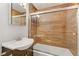 Bathroom featuring a wood-look tiled shower with glass doors and a modern vanity at 4075 E Oquendo Rd, Las Vegas, NV 89120