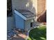 Custom-built dog house, designed to match the house's aesthetic, providing a cozy and stylish shelter for pets at 4075 E Oquendo Rd, Las Vegas, NV 89120