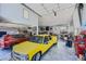 Huge garage with multiple cars and lifts, great for car enthusiasts and mechanics at 4075 E Oquendo Rd, Las Vegas, NV 89120