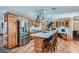 Spacious kitchen featuring a large island, stainless steel appliances, and custom cabinetry at 4075 E Oquendo Rd, Las Vegas, NV 89120