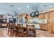 Modern kitchen with stainless steel appliances, a large island, and ample cabinet space at 4075 E Oquendo Rd, Las Vegas, NV 89120