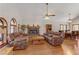 Spacious living room with hardwood floors, fireplace, and comfortable seating at 4075 E Oquendo Rd, Las Vegas, NV 89120