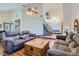 Inviting living room with high ceilings, hardwood floors, comfortable seating, and abundant natural light at 4075 E Oquendo Rd, Las Vegas, NV 89120