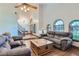 Open-concept living room with high ceilings and lots of natural light at 4075 E Oquendo Rd, Las Vegas, NV 89120